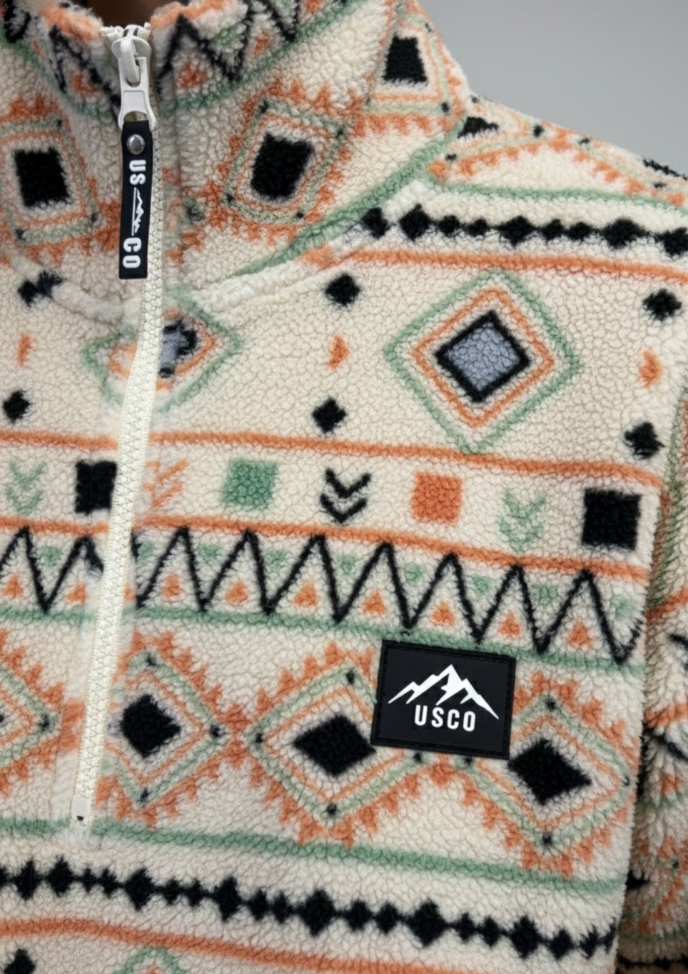The Trek fleece in cream/orange southwestern