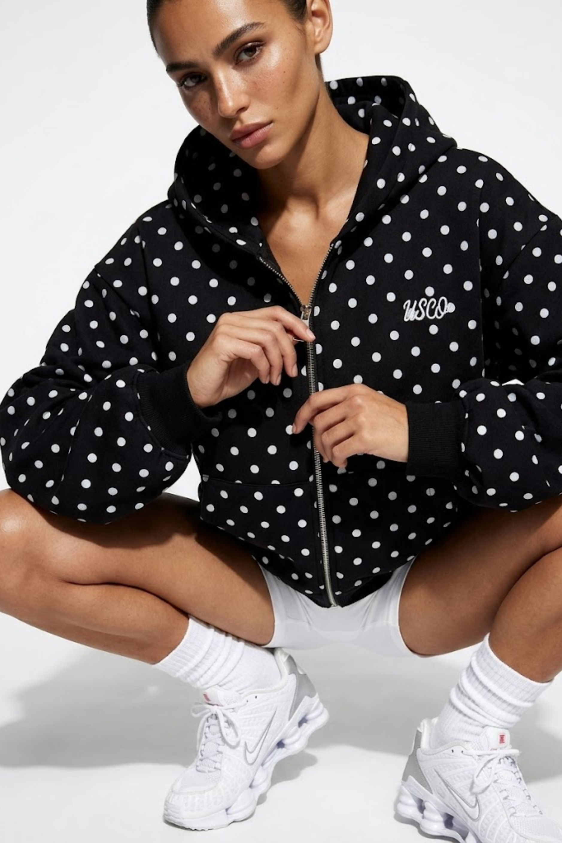 The Minnie zip up in Black Polka Dot