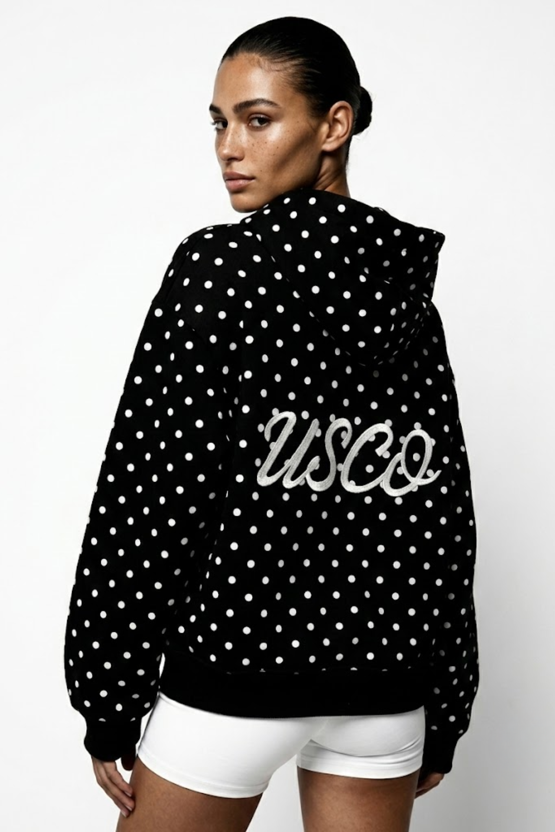 The Minnie zip up in Black Polka Dot