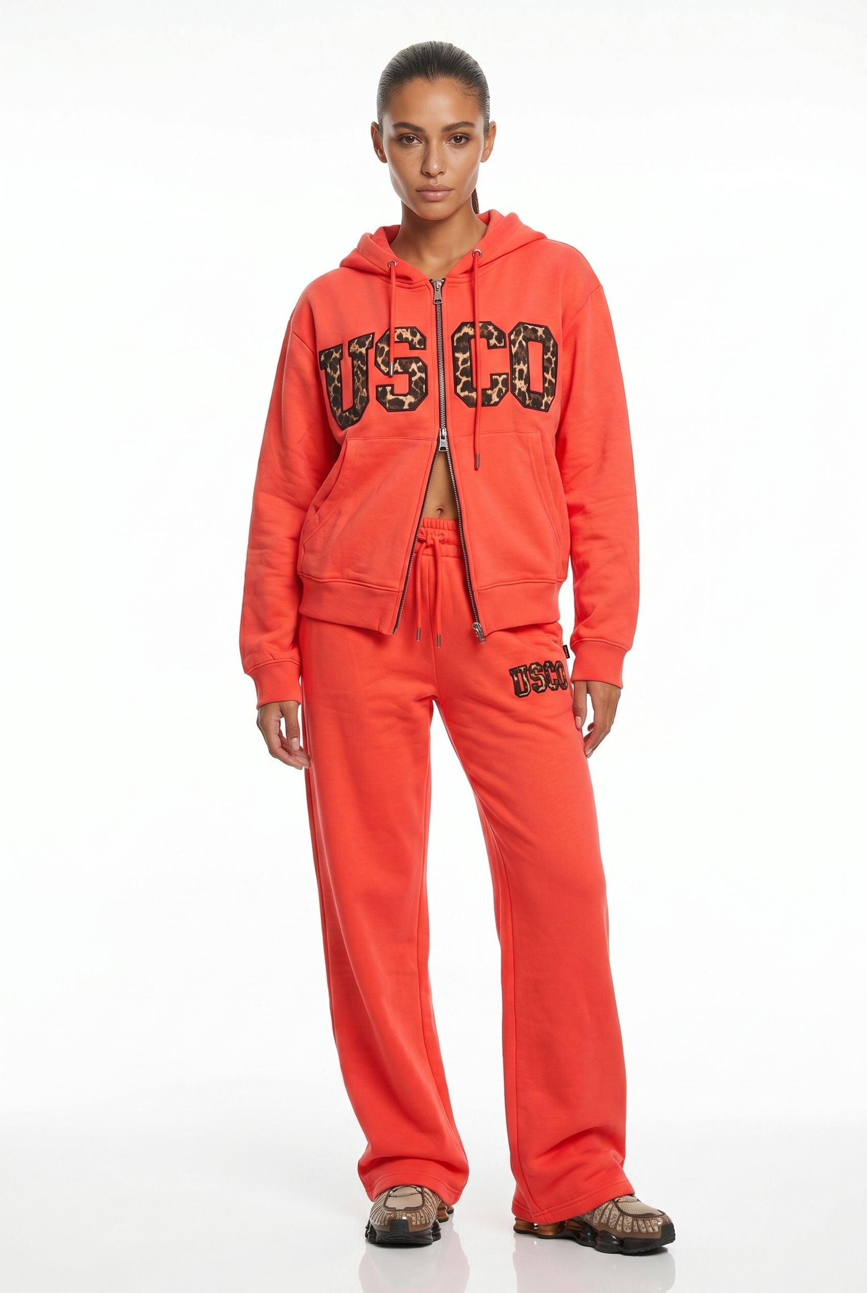 THE UNTAMED TRACKSUIT IN CORAL
