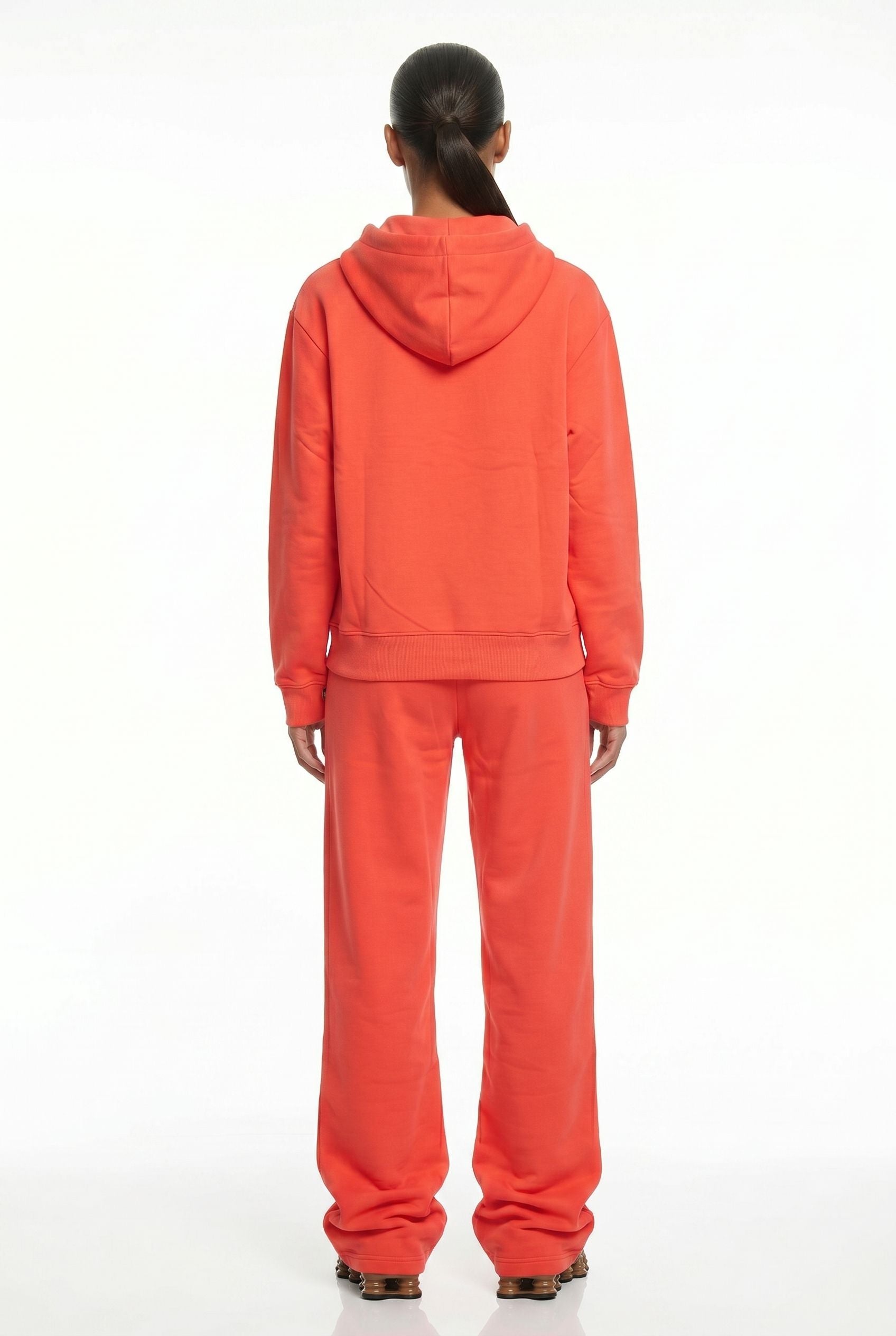 THE UNTAMED TRACKSUIT IN CORAL