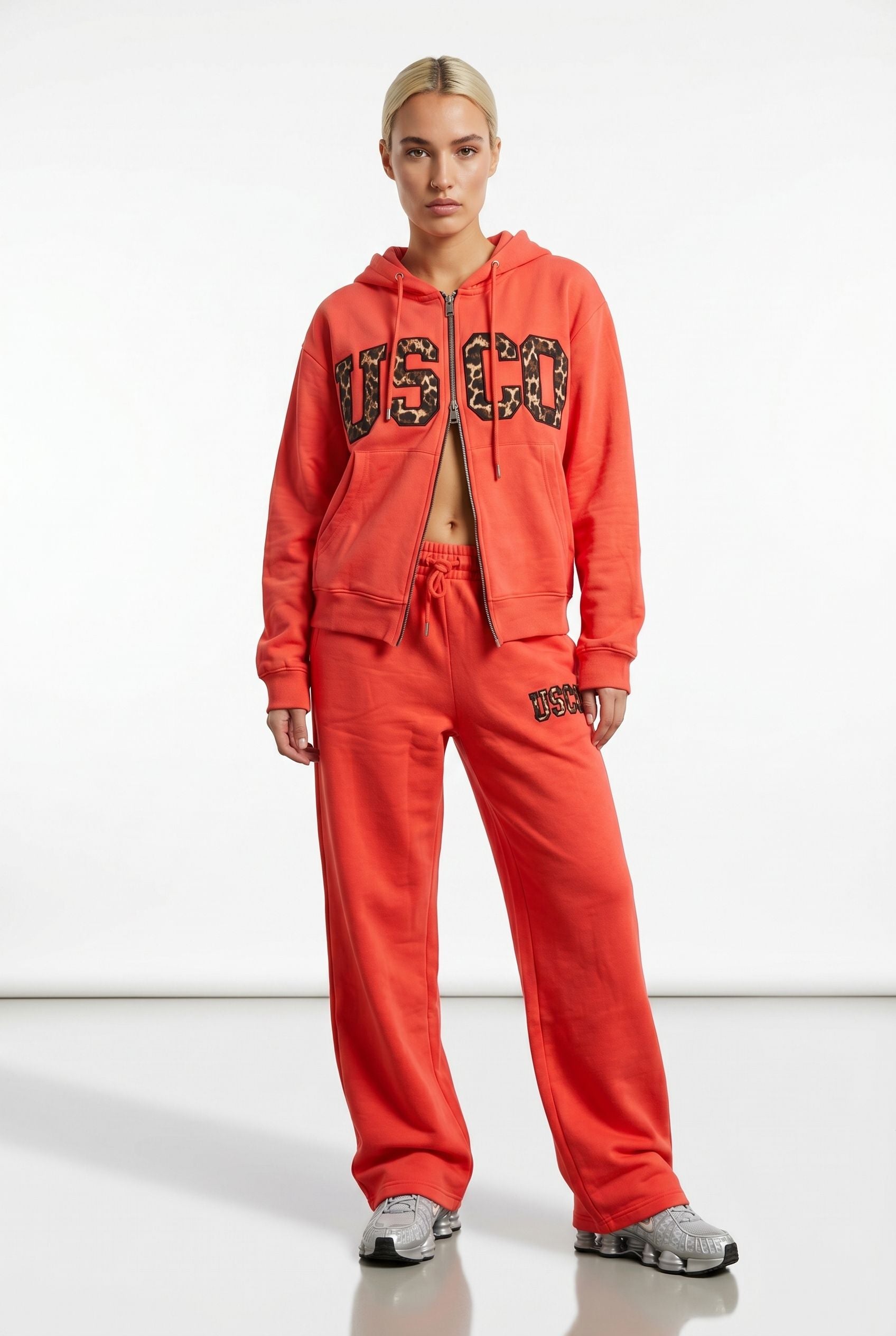 THE UNTAMED TRACKSUIT IN CORAL